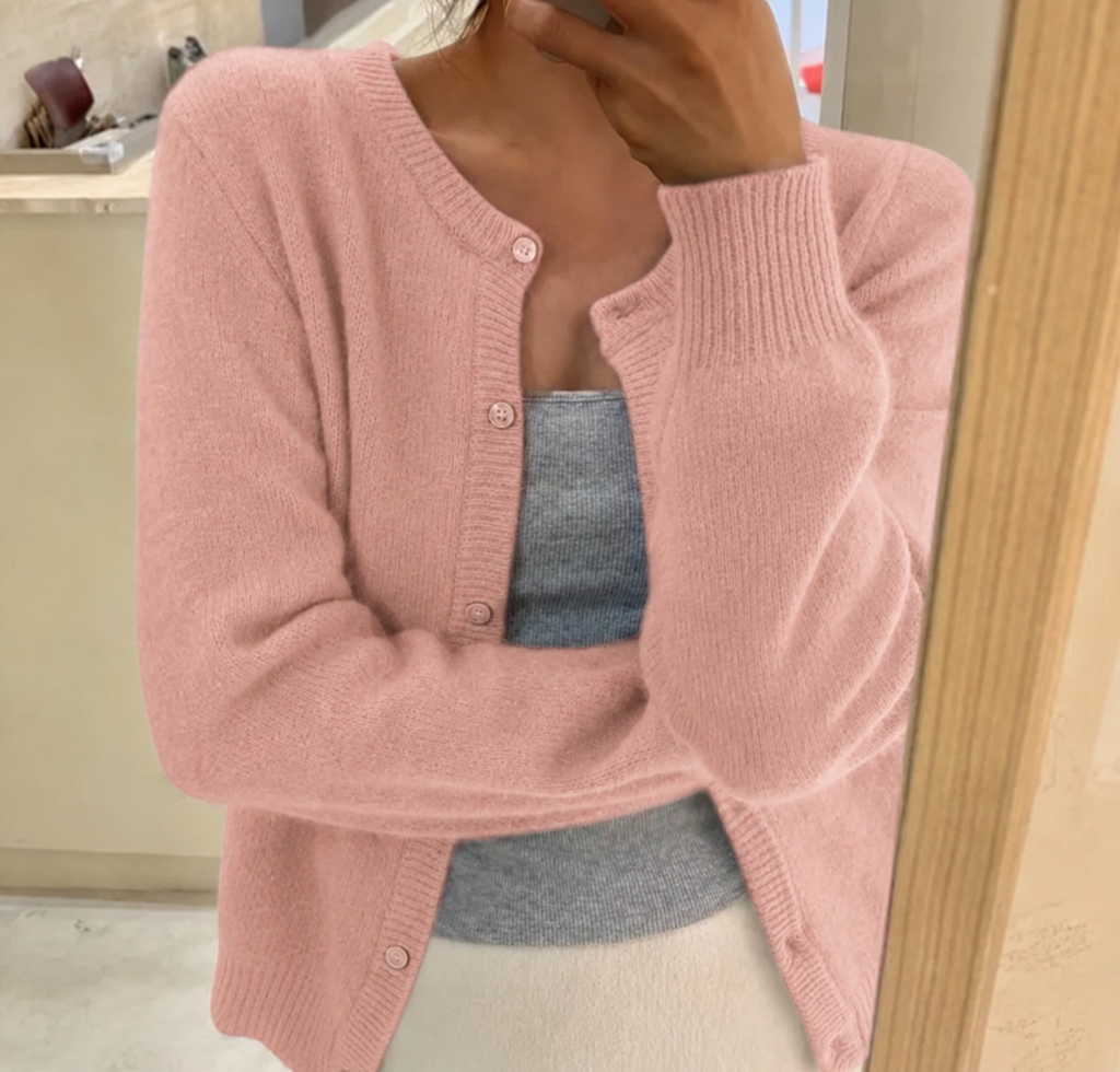 Women's waist-length knit cardigan with round neck and button front