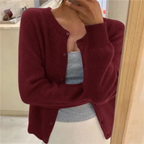Women's waist-length knit cardigan with round neck and button front
