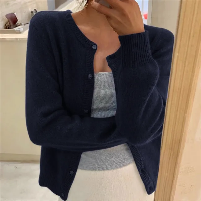Women's waist-length knit cardigan with round neck and button front