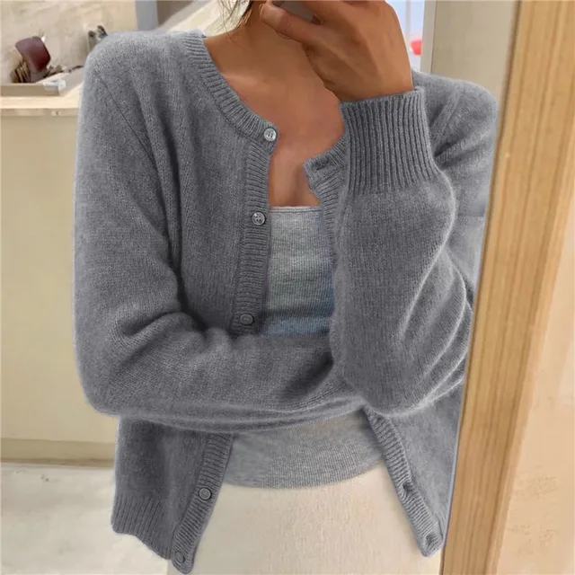 Women's waist-length knit cardigan with round neck and button front