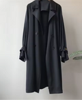 Women's long double breasted trench coat with lapel collar and cuff straps