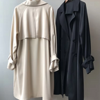 Women's long double breasted trench coat with lapel collar and cuff straps