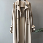 Women's long double breasted trench coat with lapel collar and cuff straps