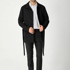 Men's black short trench coat with button front and flap pockets