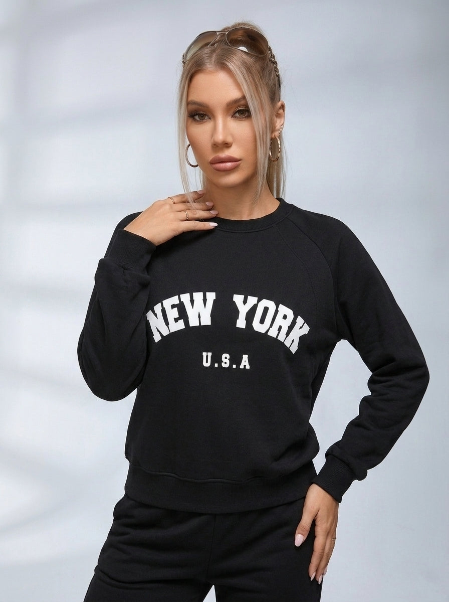 Women's black crew neck sweatshirt with white New York USA lettering
