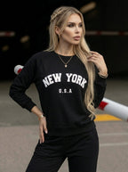 Women's black crew neck sweatshirt with white New York USA lettering