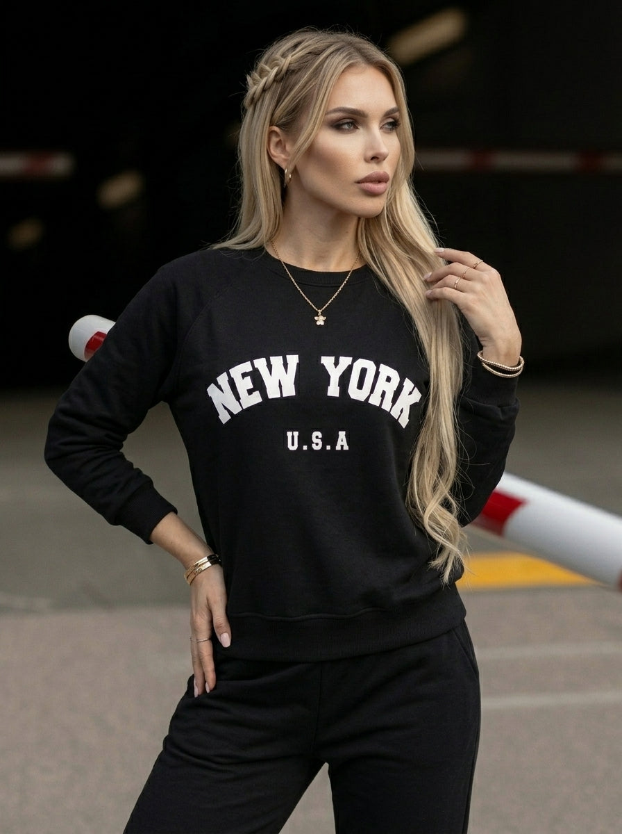 Women's black crew neck sweatshirt with white New York USA lettering