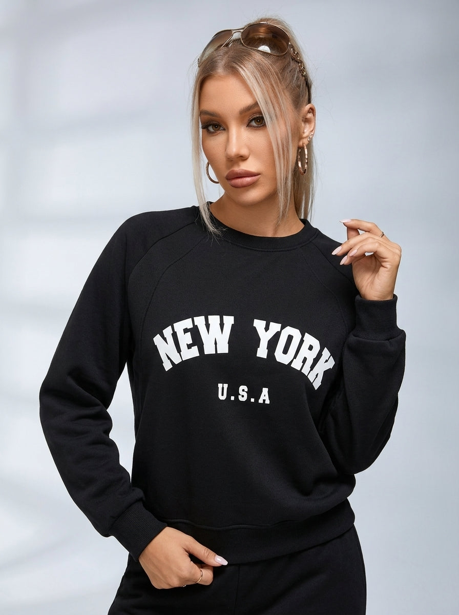 Women's black crew neck sweatshirt with white New York USA lettering
