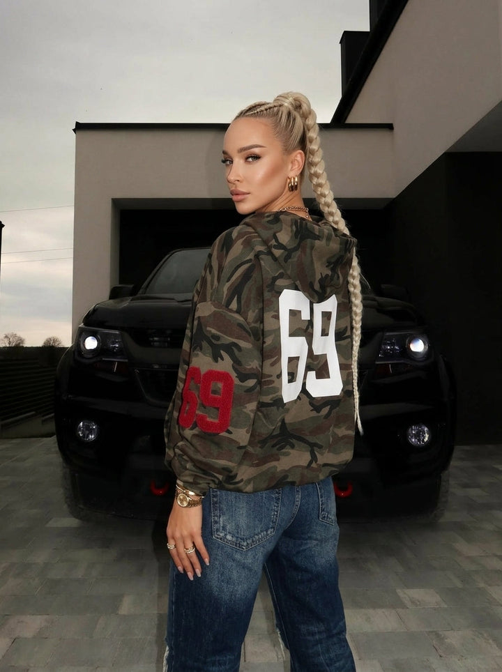 Women's olive camouflage hoodie with zip front, hood and graphic details