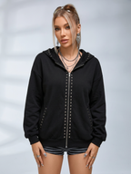 Black oversized hooded hoodie with full zip fastening, stud details and zipped pockets