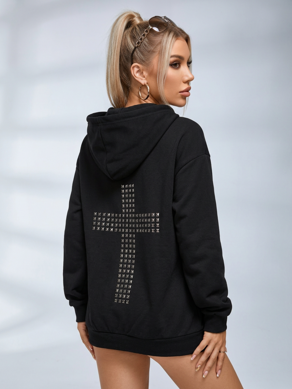 Black oversized hooded hoodie with full zip fastening, stud details and zipped pockets