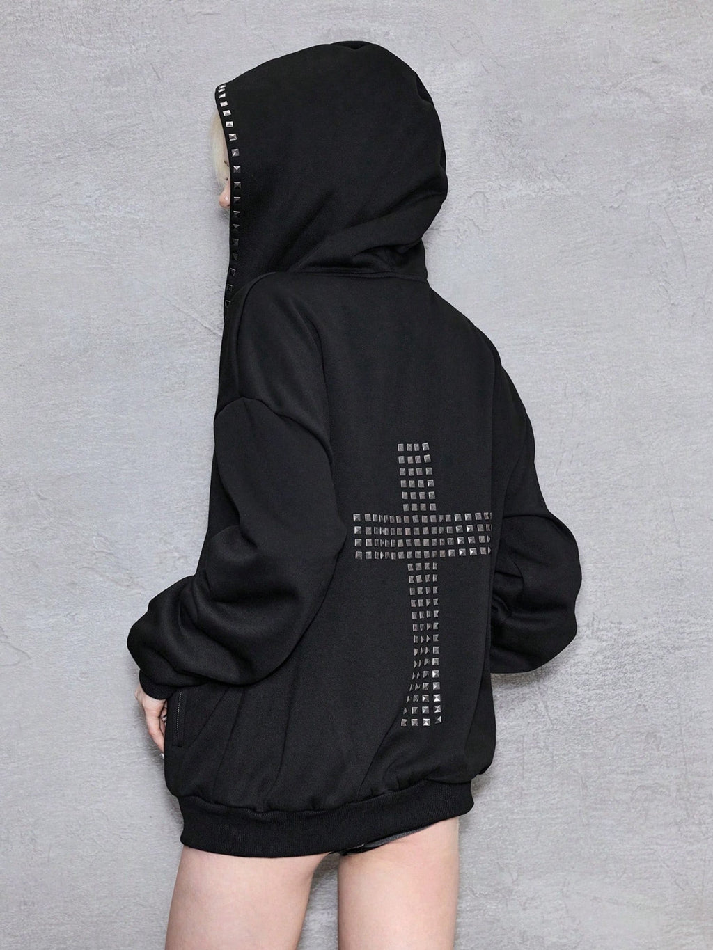 Black oversized hooded hoodie with full zip fastening, stud details and zipped pockets