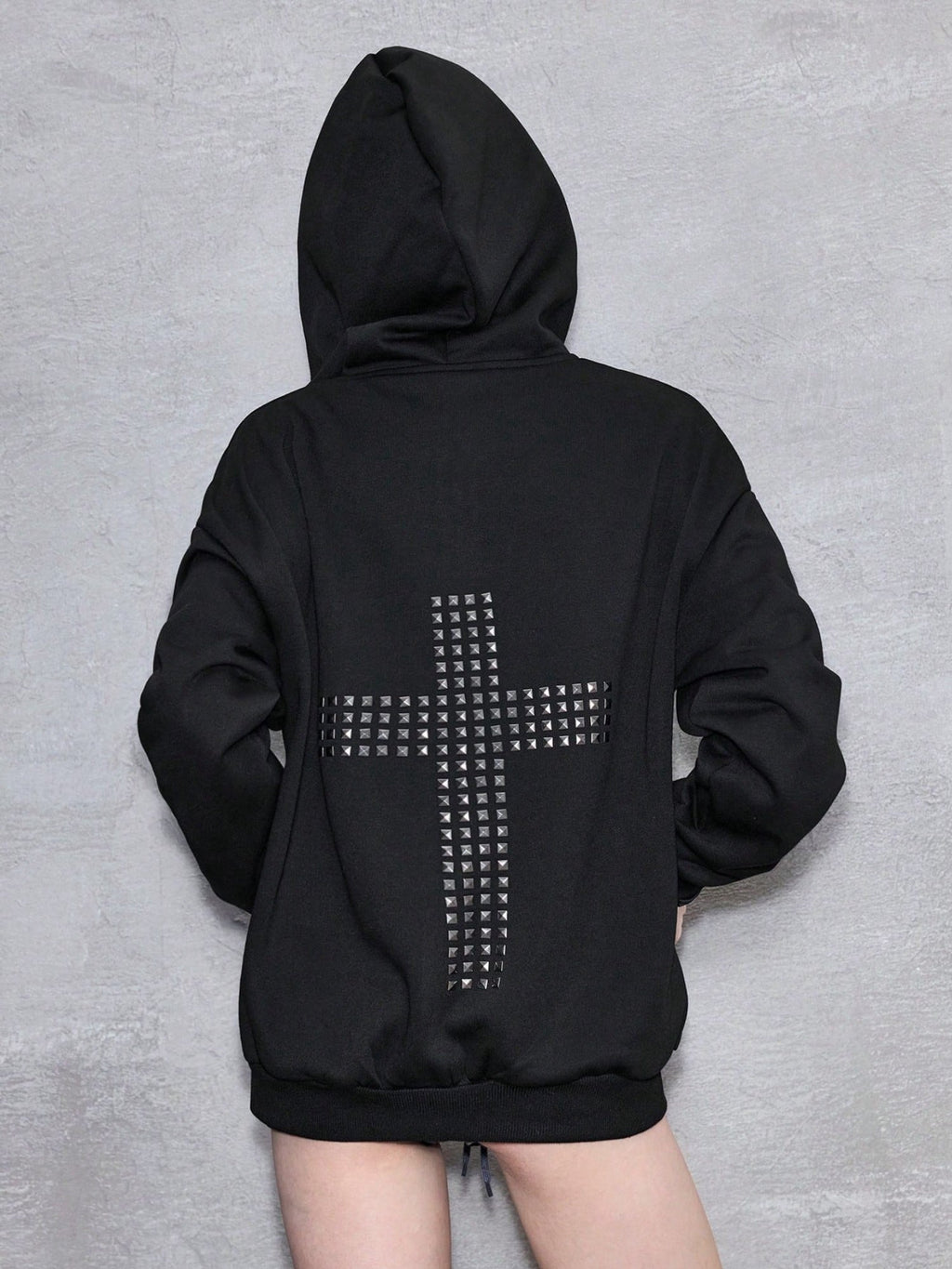 Black oversized hooded hoodie with full zip fastening, stud details and zipped pockets