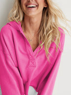 Women's relaxed hooded half-zip hoodie with long sleeves and ribbed trims