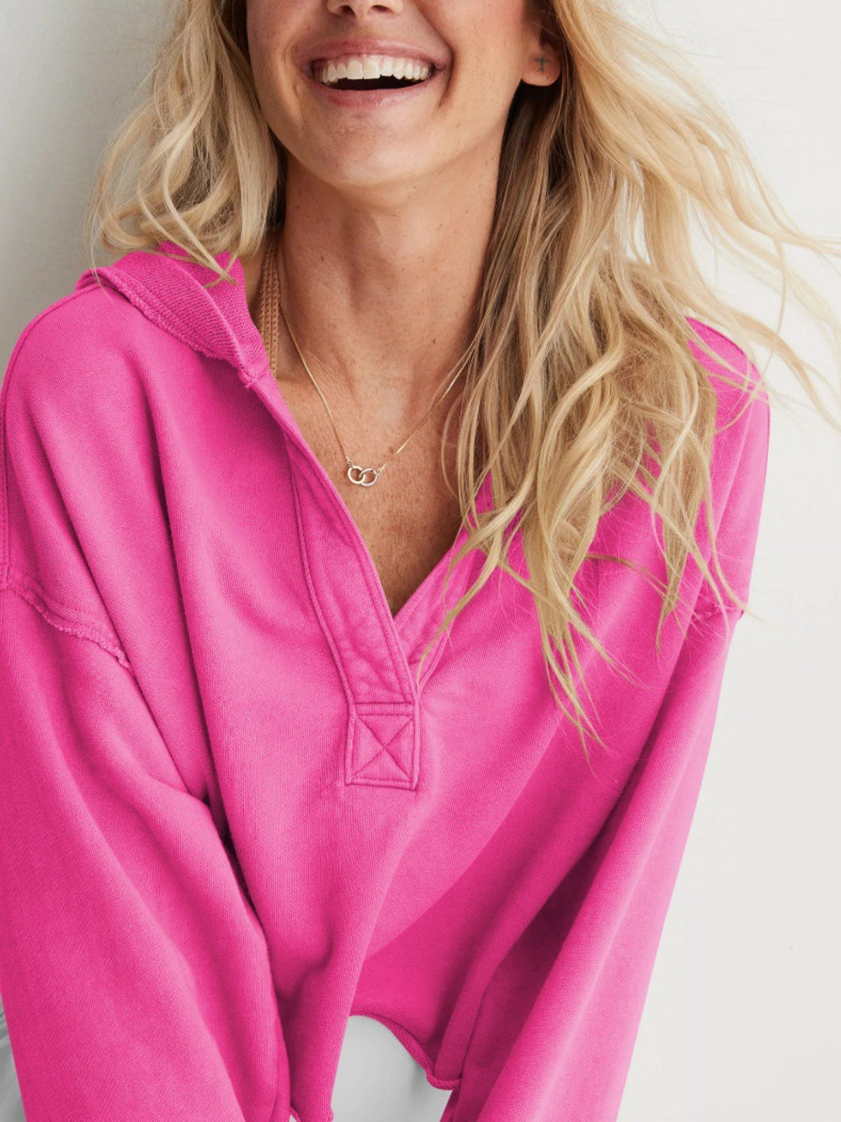 Women's relaxed hooded half-zip hoodie with long sleeves and ribbed trims