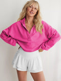 Women's relaxed hooded half-zip hoodie with long sleeves and ribbed trims