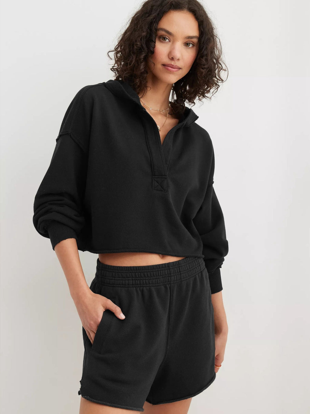 Women's relaxed hooded half-zip hoodie with long sleeves and ribbed trims