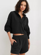 Women's relaxed hooded half-zip hoodie with long sleeves and ribbed trims