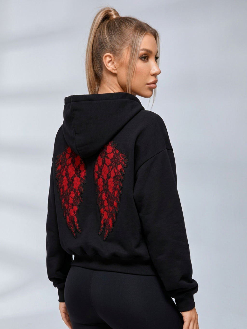 Women's cropped embossed hoodie with drawstring hood and wing back detail