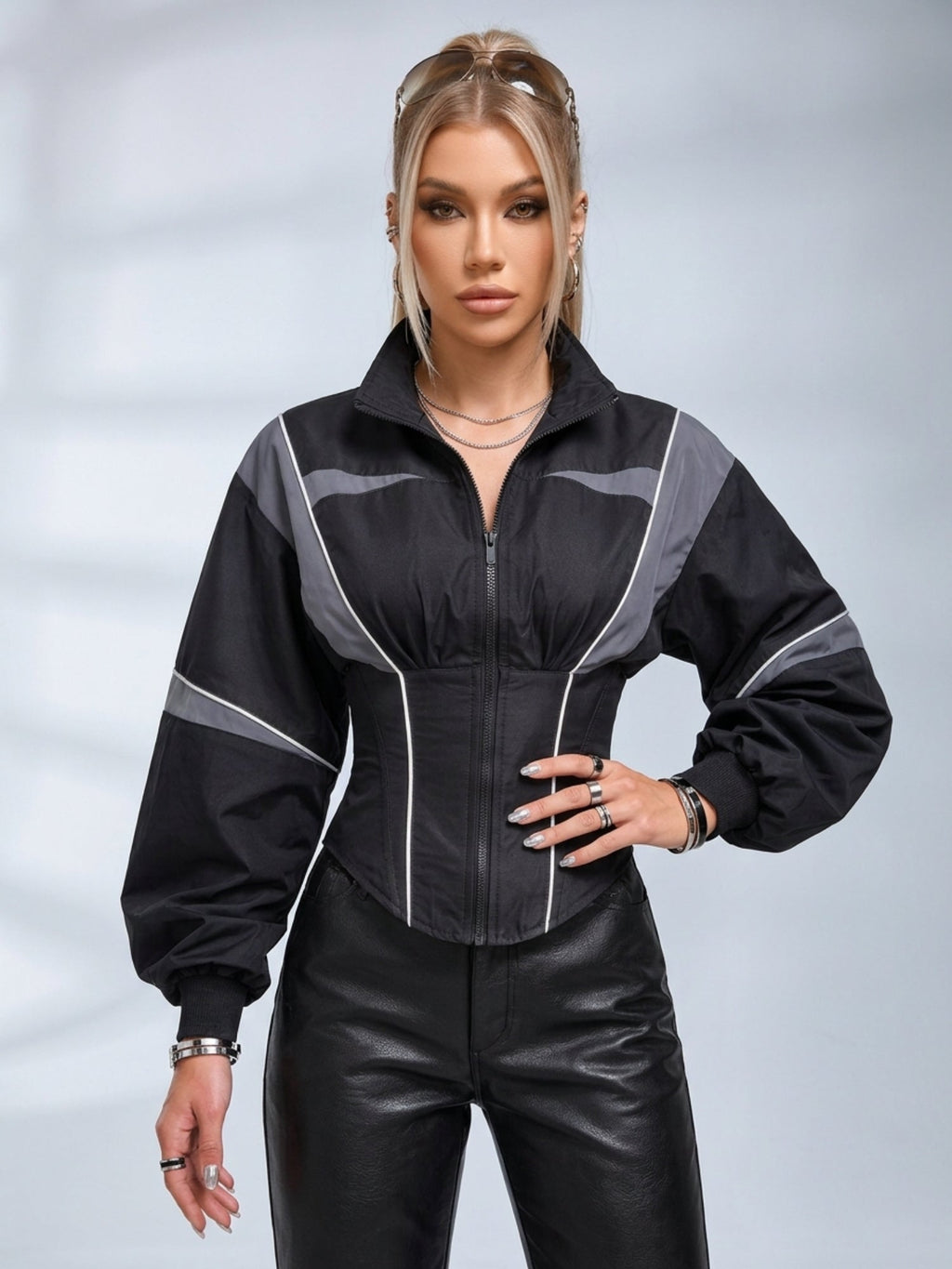 Women's black colour block jacket with grey panels, mock neck and cinched waist