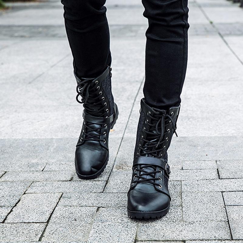 Men's black combat boots with lace-up front and buckle straps