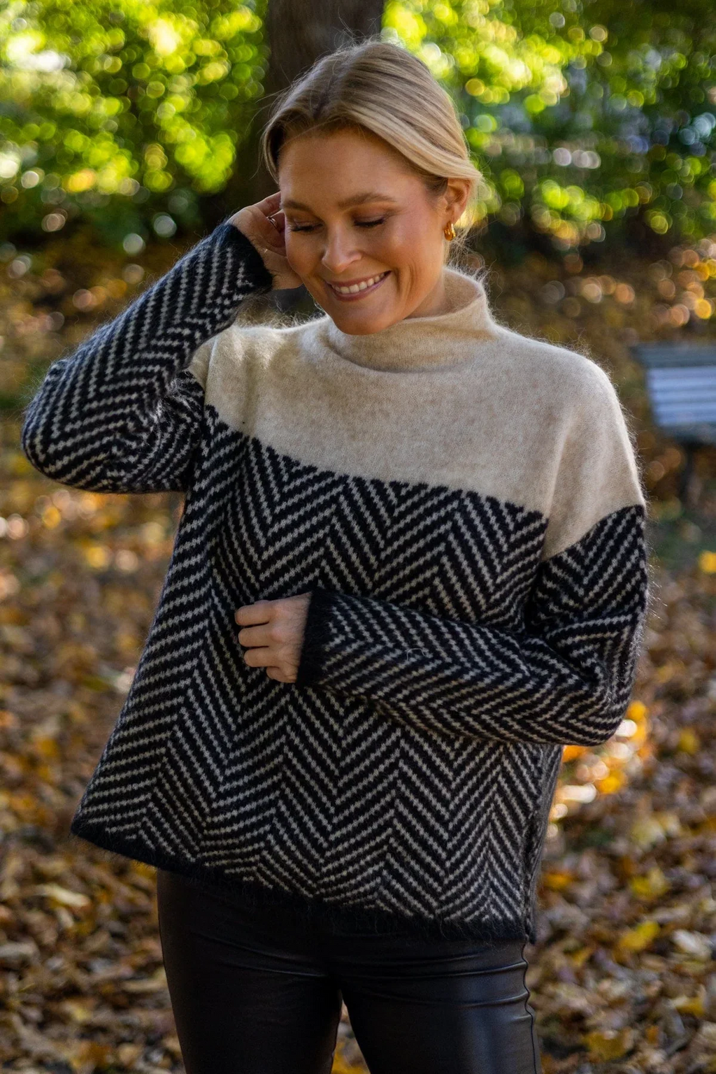 Women's chevron turtleneck sweater with contrasting patterned sleeves