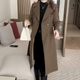 Women's long double-breasted trench coat with notched lapels and long sleeves