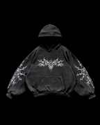 Unisex hooded hoodie with abstract thorn-like chest and sleeve graphics