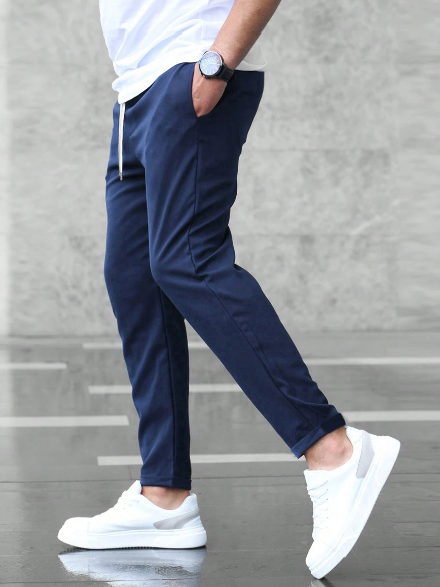 Men's slim fit jogger pants with drawstring waist and tapered cuff in grey