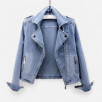 Women's light blue cropped denim jacket with lapel collar and zip pockets