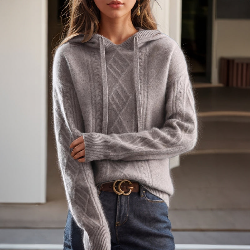 Women's cable knit hooded sweater with drawstrings and long sleeves