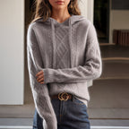 Women's cable knit hooded sweater with drawstrings and long sleeves
