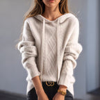 Women's cable knit hooded sweater with drawstrings and long sleeves