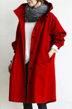 Women's long hooded raincoat with button front and side pockets