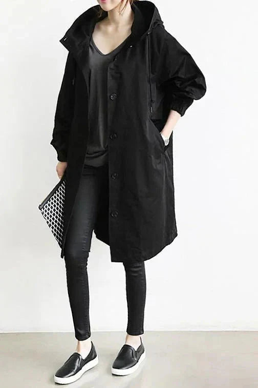 Women's long hooded raincoat with button front and side pockets