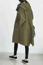 Women's long hooded raincoat with button front and side pockets