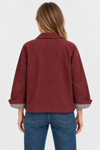Women's short trench jacket with button front, patch pockets and checked turn-up cuffs