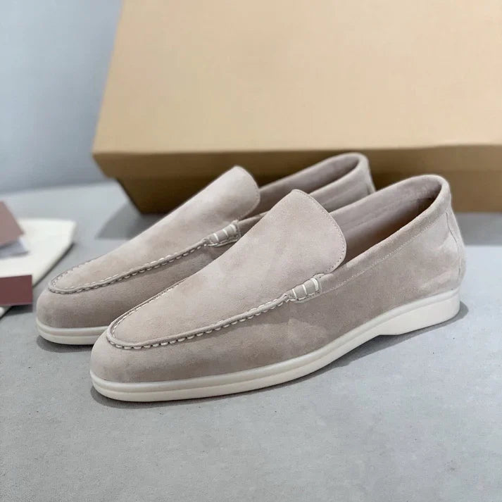 Men's slip-on loafers with textured uppers, moc toe stitching and white flat soles