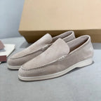 Men's slip-on loafers with textured uppers, moc toe stitching and white flat soles