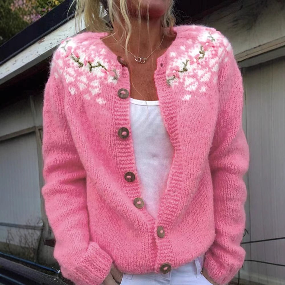 Women's pink floral knit cardigan with long sleeves and button front