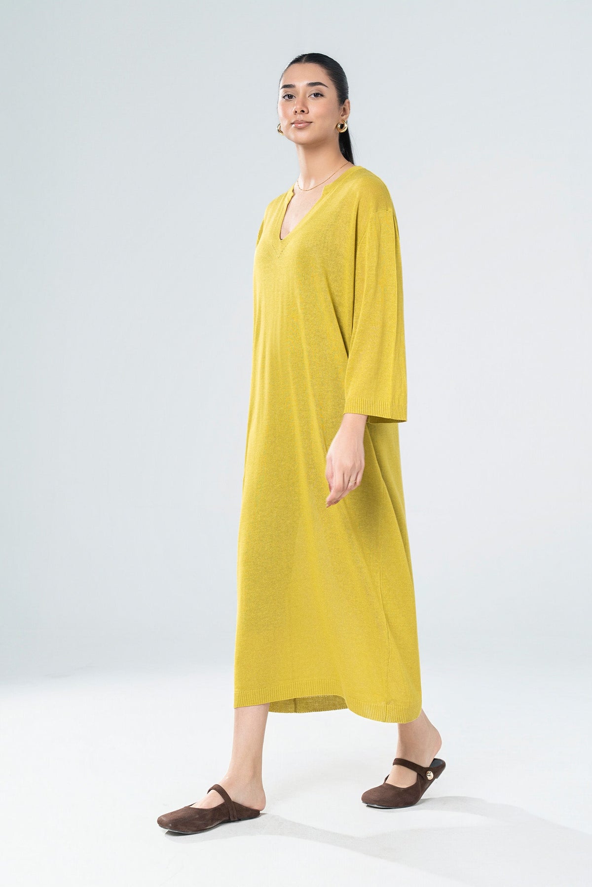 Women's yellow knit midi dress with V-neckline and 3/4 sleeves
