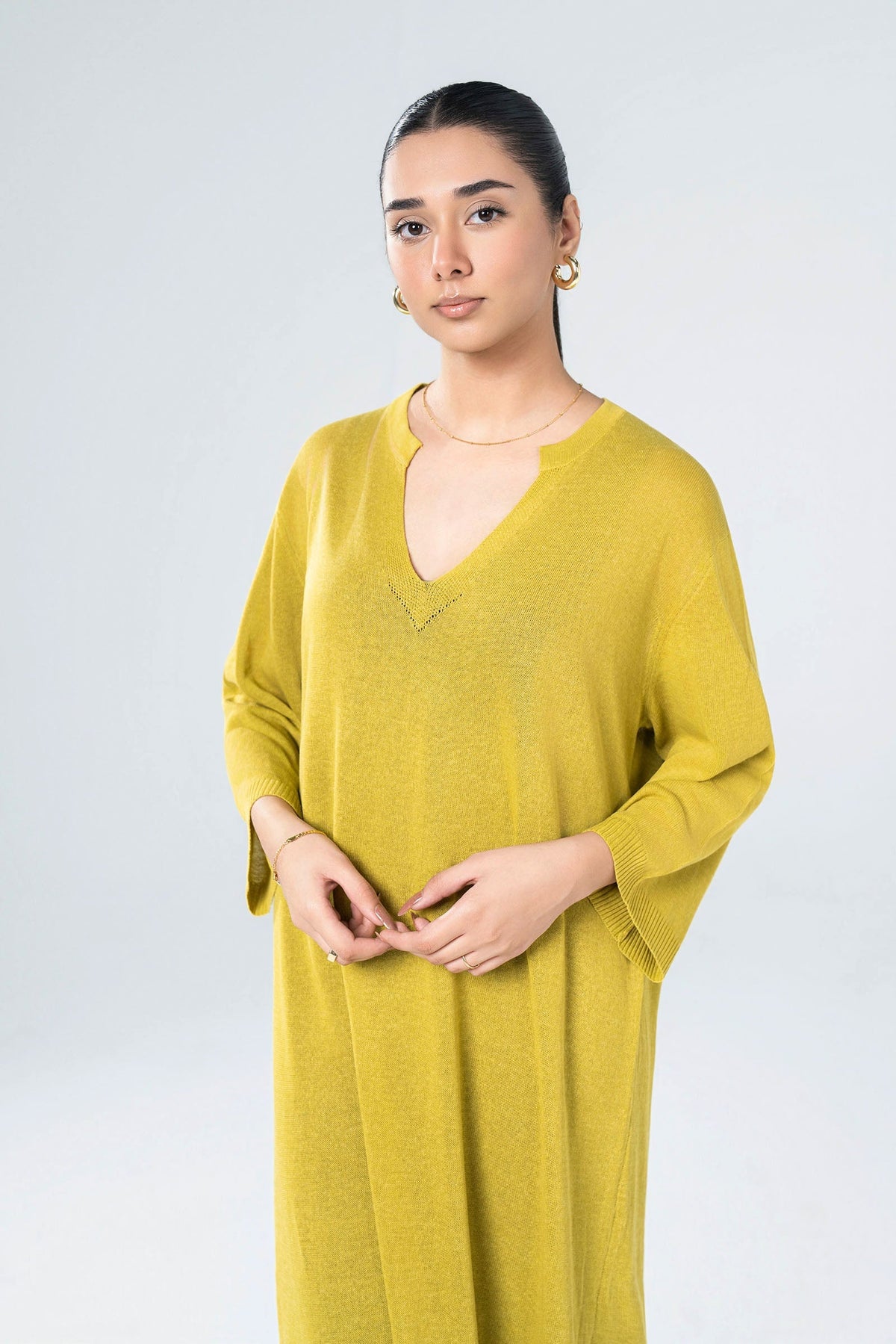 Women's yellow knit midi dress with V-neckline and 3/4 sleeves