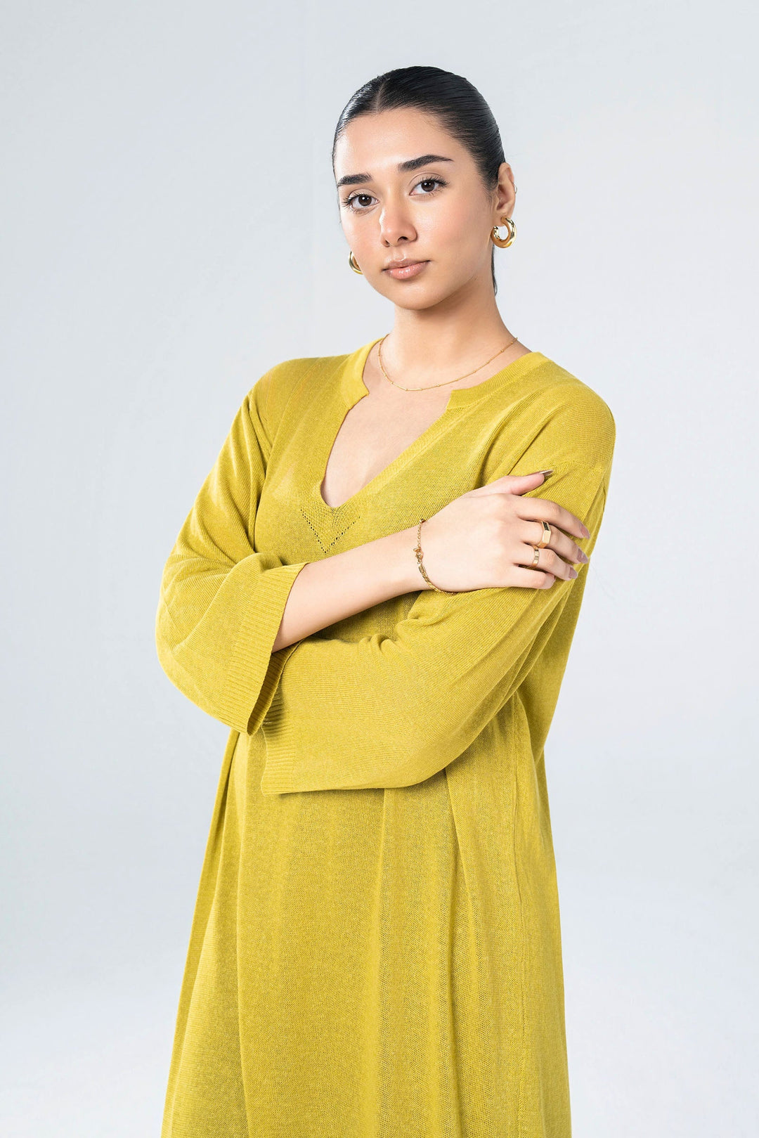 Women's yellow knit midi dress with V-neckline and 3/4 sleeves