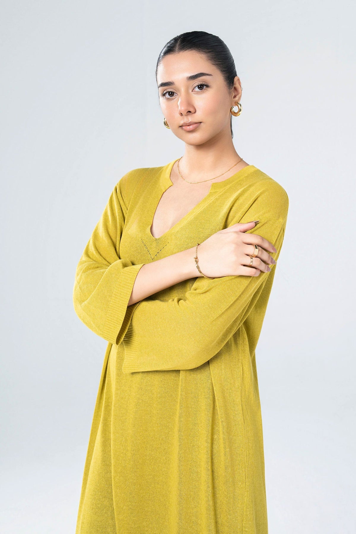 Women's yellow knit midi dress with V-neckline and 3/4 sleeves
