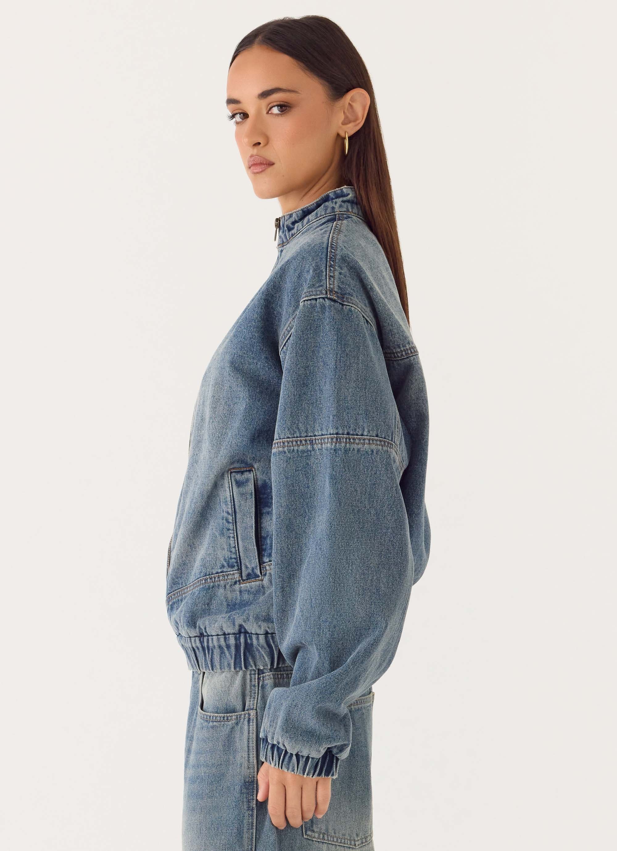 Men's mid-wash blue denim bomber jacket