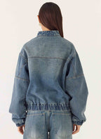 Men's mid-wash blue denim bomber jacket
