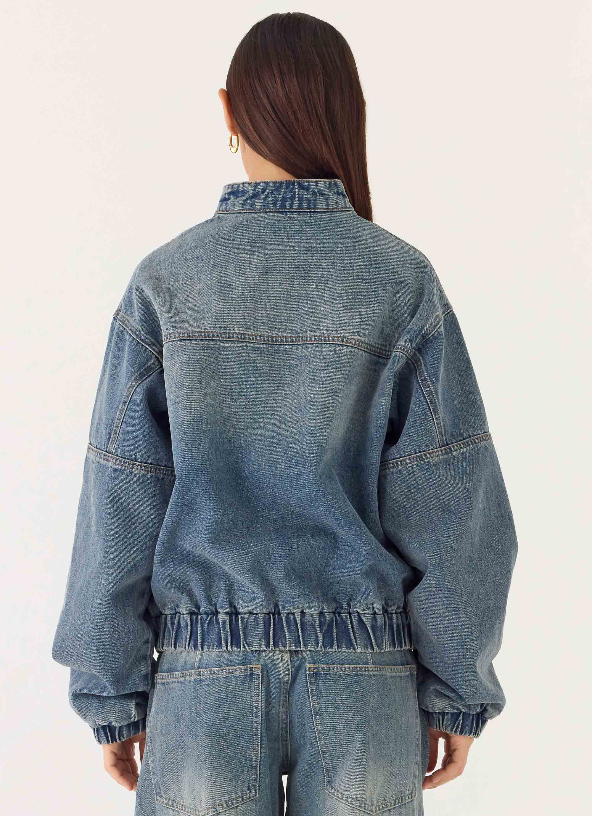 Men's mid-wash blue denim bomber jacket