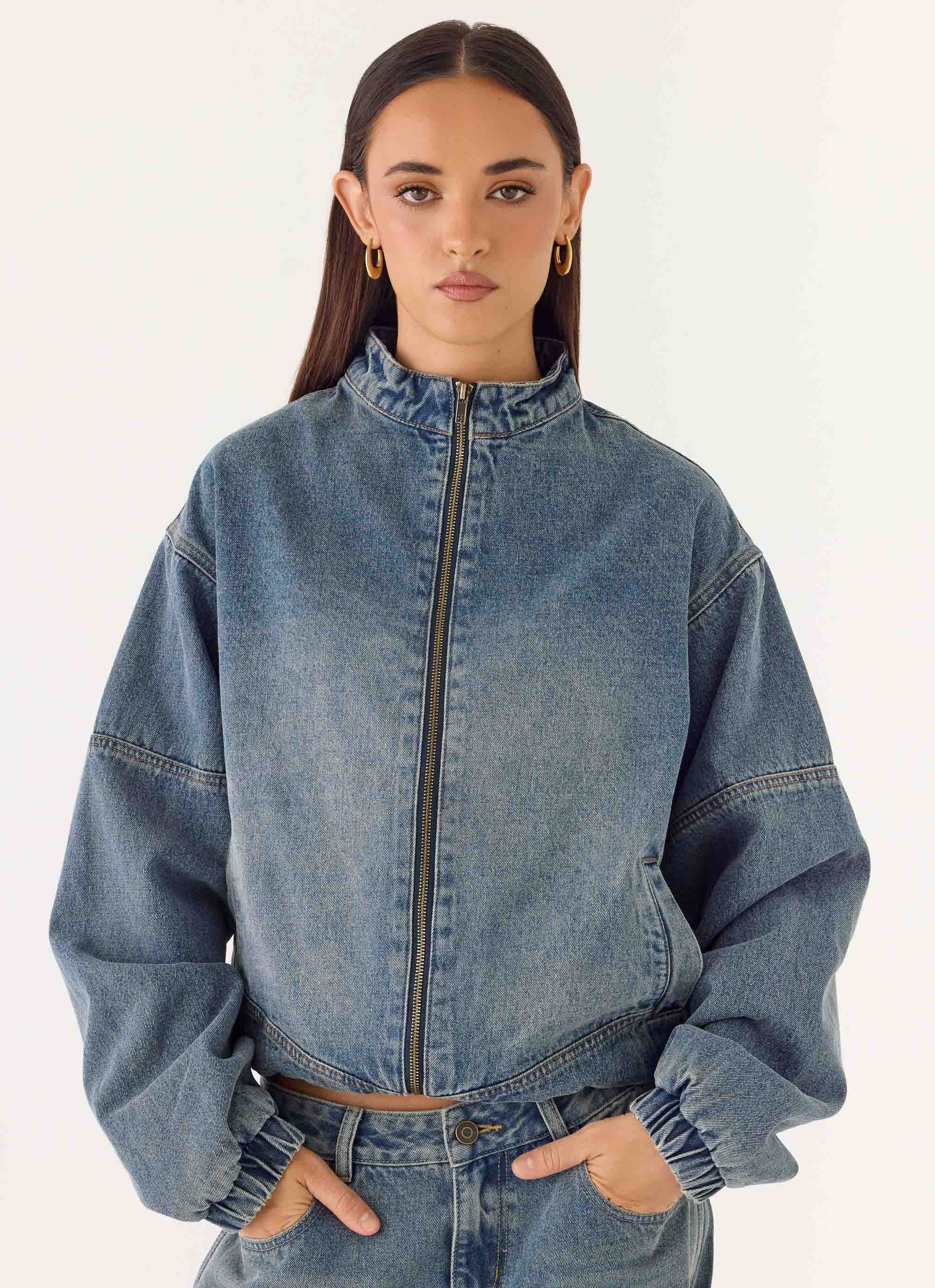 Men's mid-wash blue denim bomber jacket