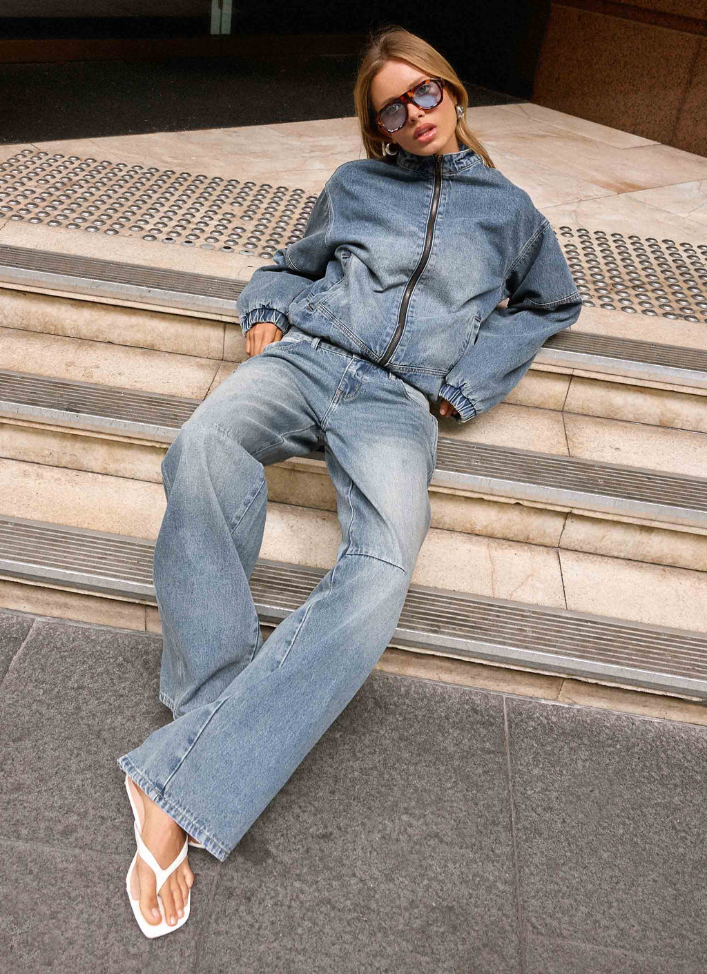Men's mid-wash blue denim bomber jacket