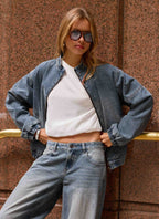 Men's mid-wash blue denim bomber jacket